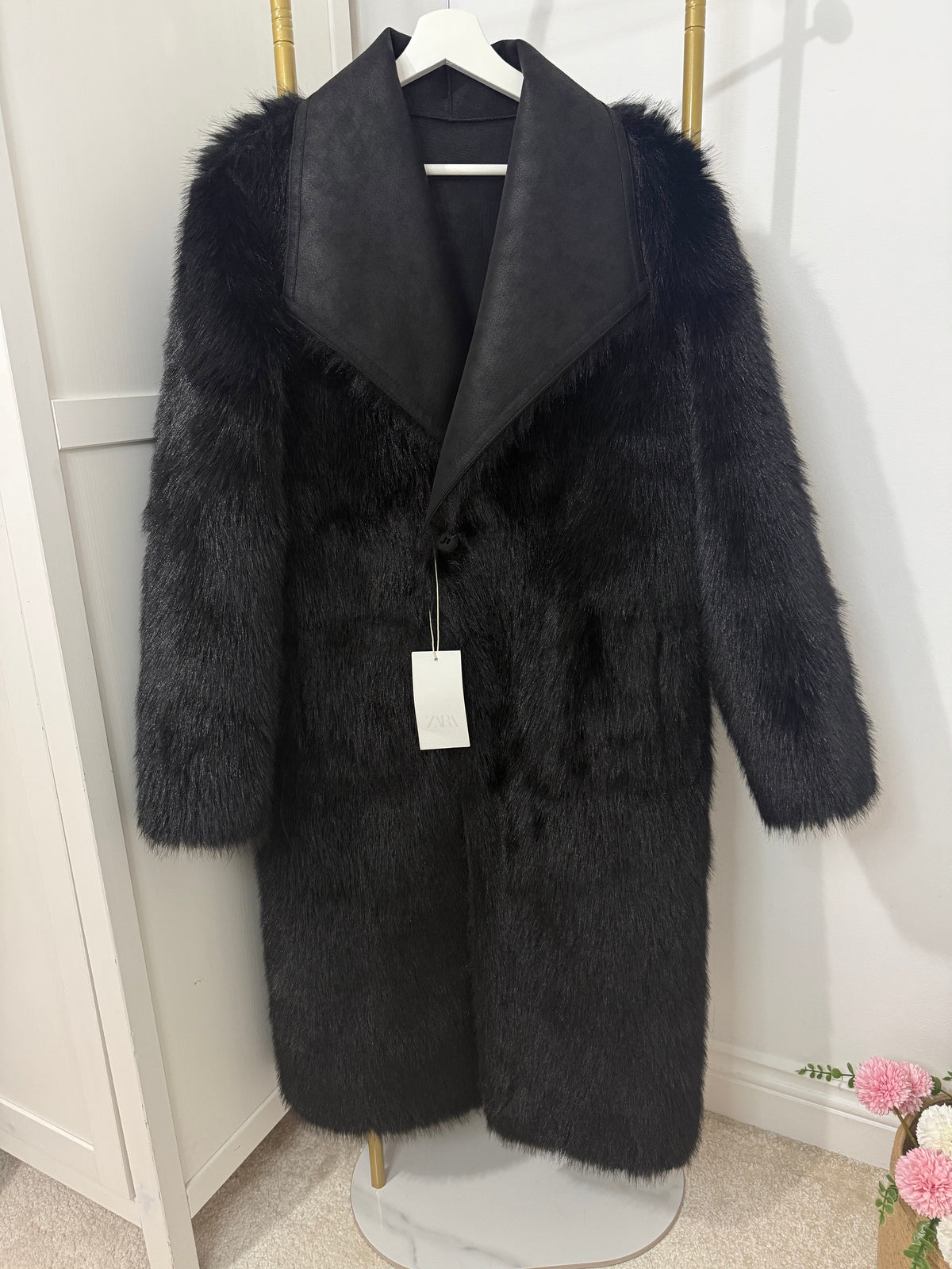    Front view of Zara black faux fur coat with tag