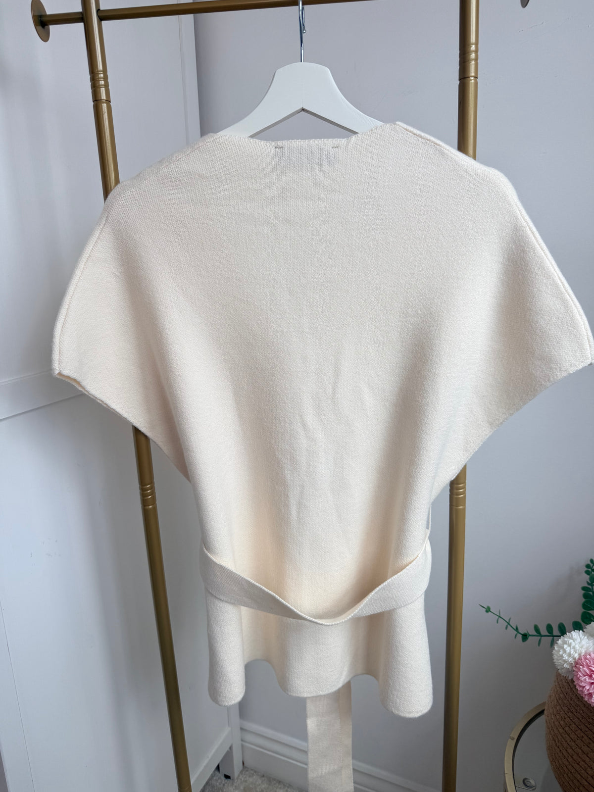     Close-up back view of Zara cream knit waistcoat