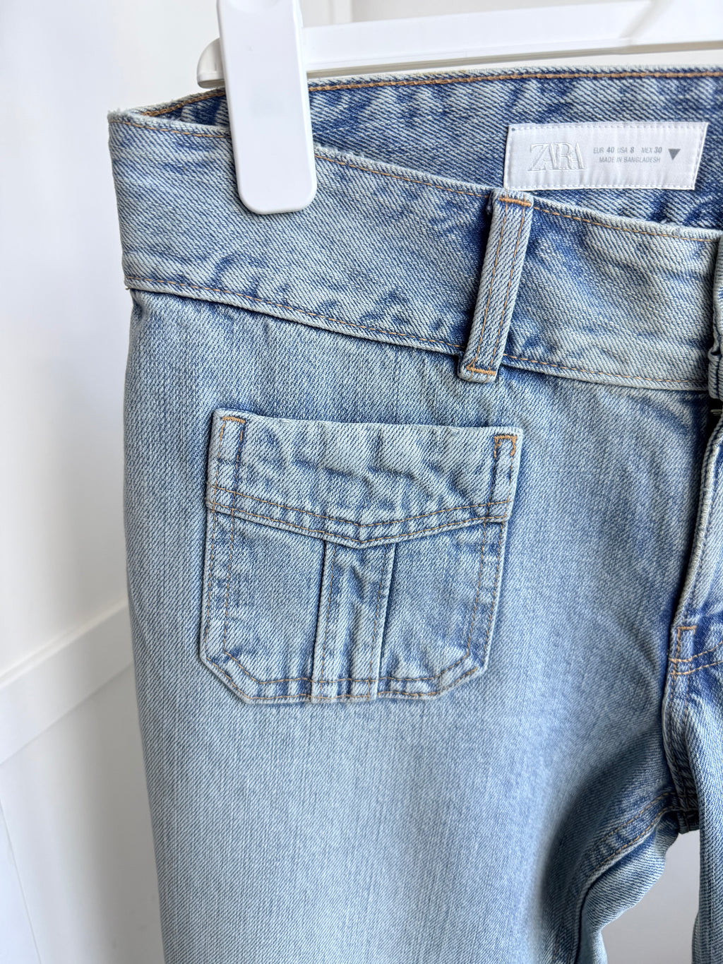     Close-up of Zara blue jeans back pocket and belt loop detail