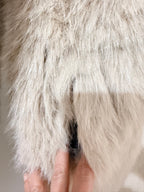     Close-up of beige faux fur texture on Zara reversible coat