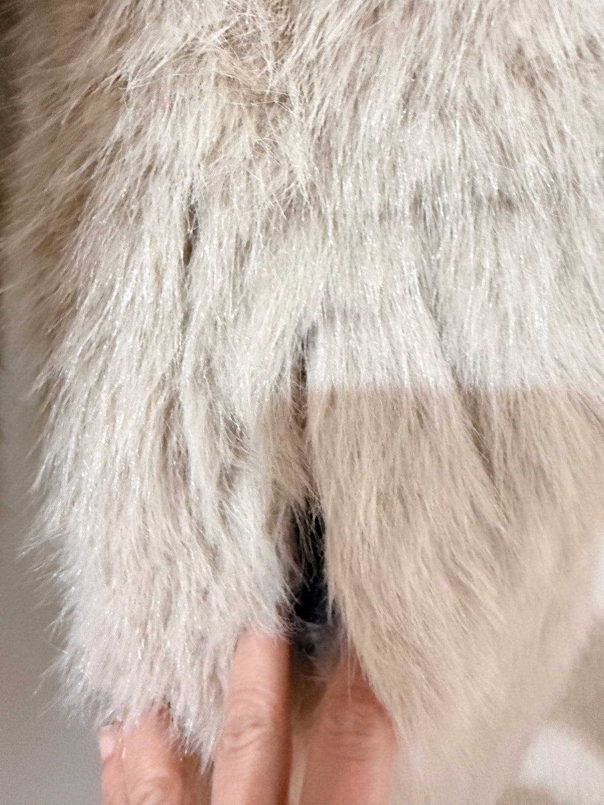     Close-up of beige faux fur texture on Zara reversible coat
