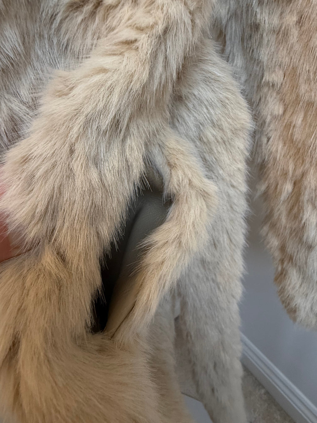     Close-up of side pocket on Zara beige faux fur belted coat