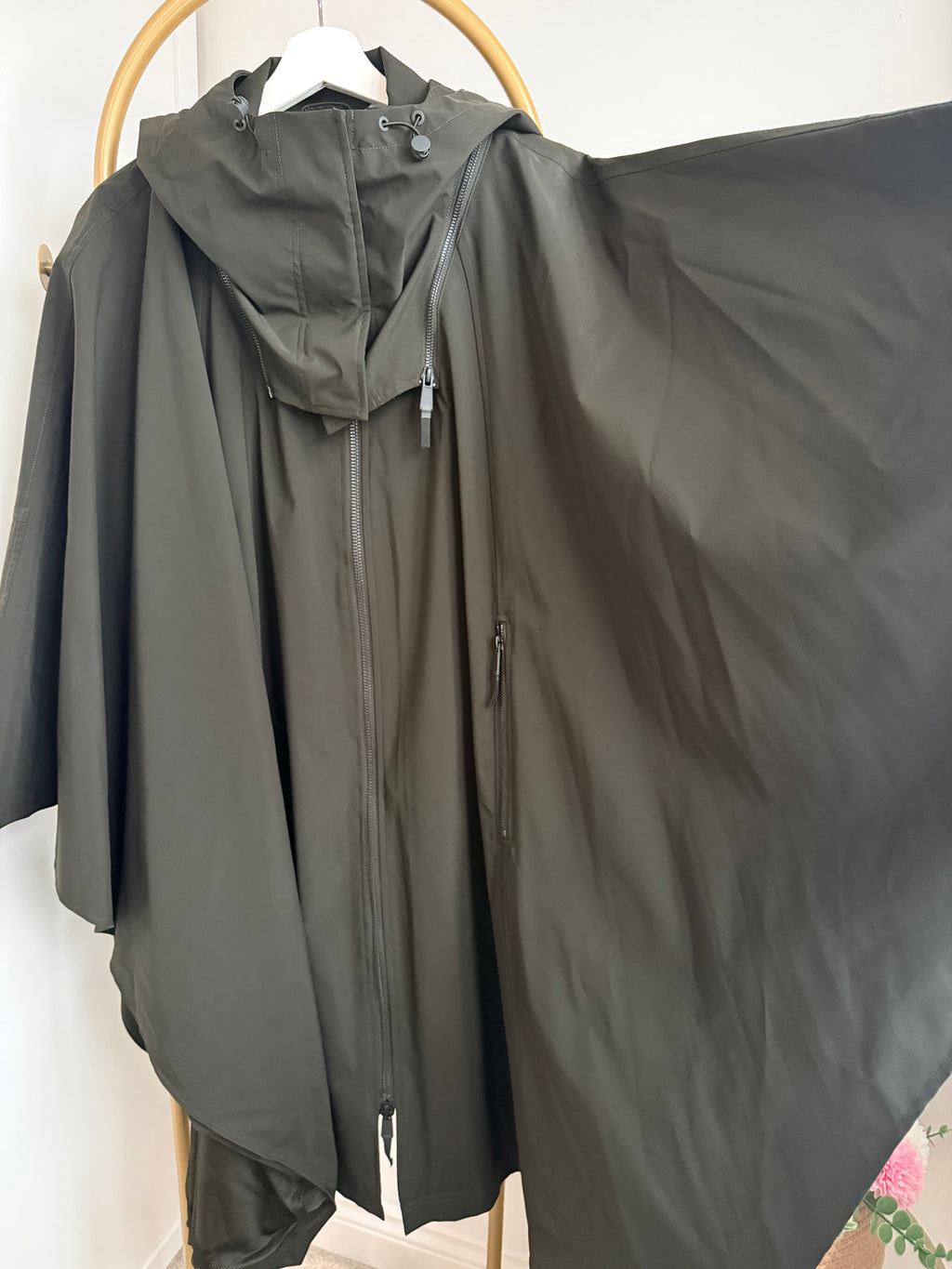     Back detail of Zara khaki hooded cape rain coat
