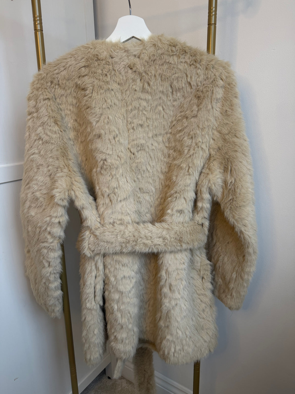     Back view of Zara beige faux fur belted coat with waist belt