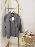     Front view of Zara grey double breasted oversized coat on hanger