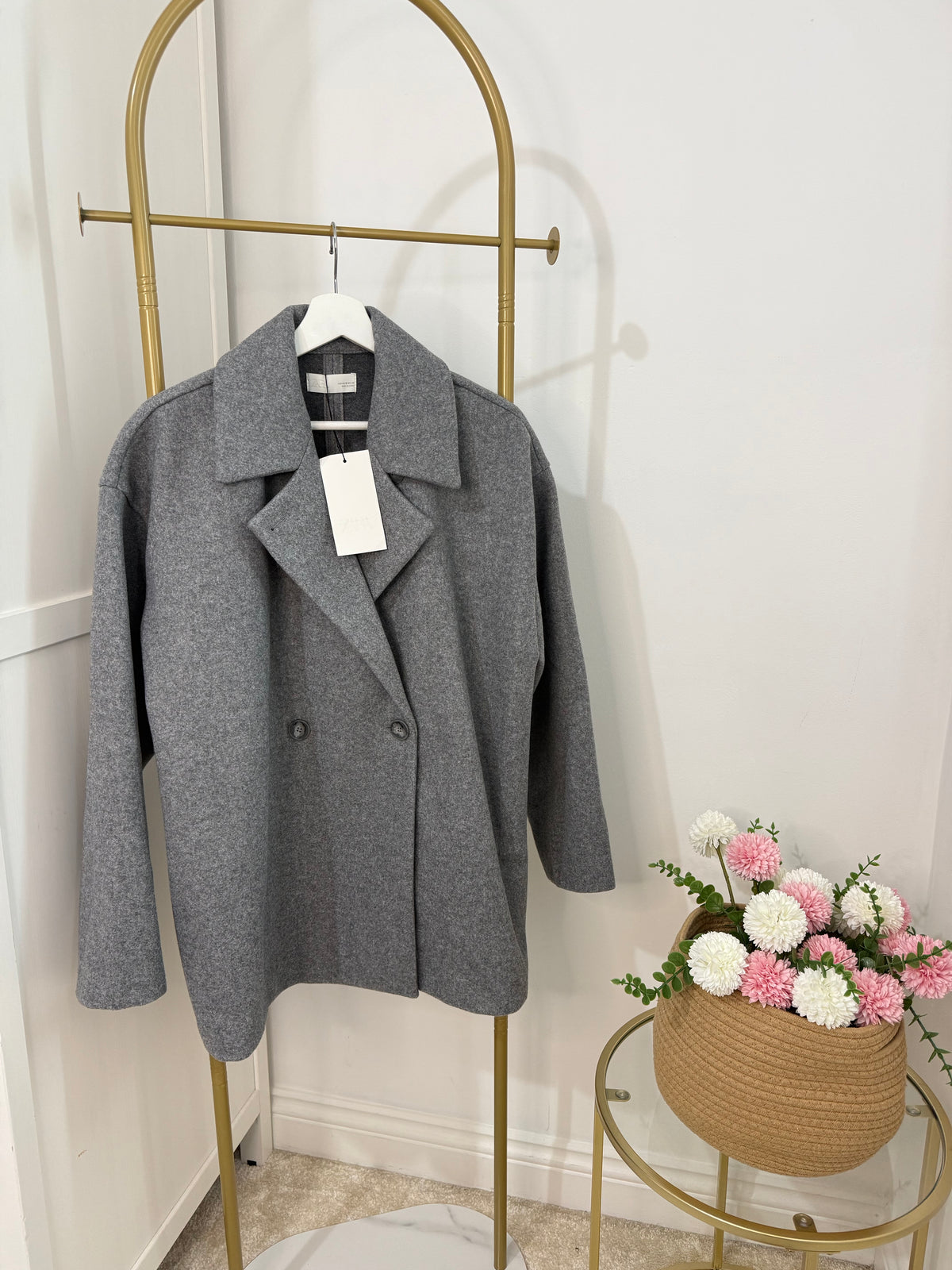     Front view of Zara grey double breasted oversized coat on hanger