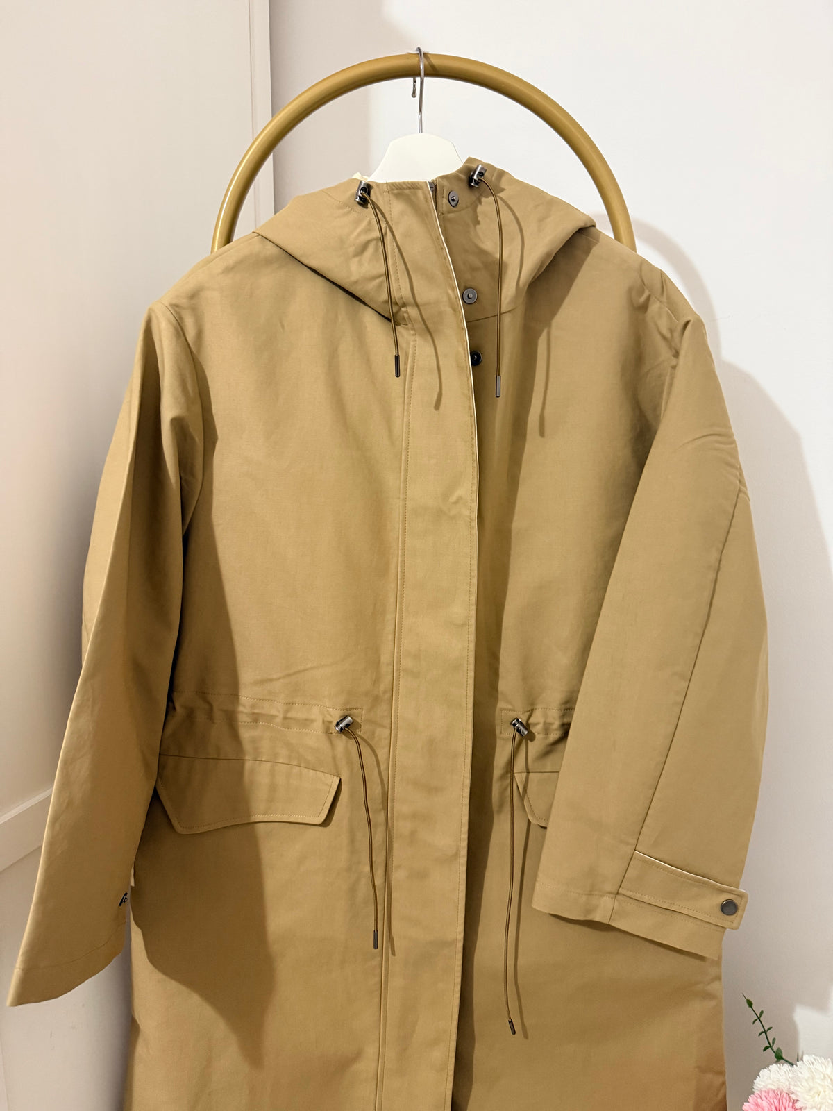     Front detail of Zara beige hooded long trench coat