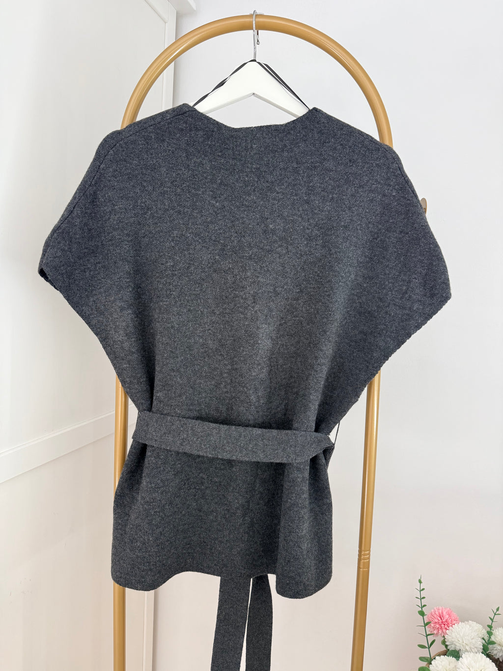     Close back view of Zara grey knit belted waistcoat