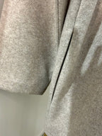         Close-up of pocket detail on Zara beige oversized coat