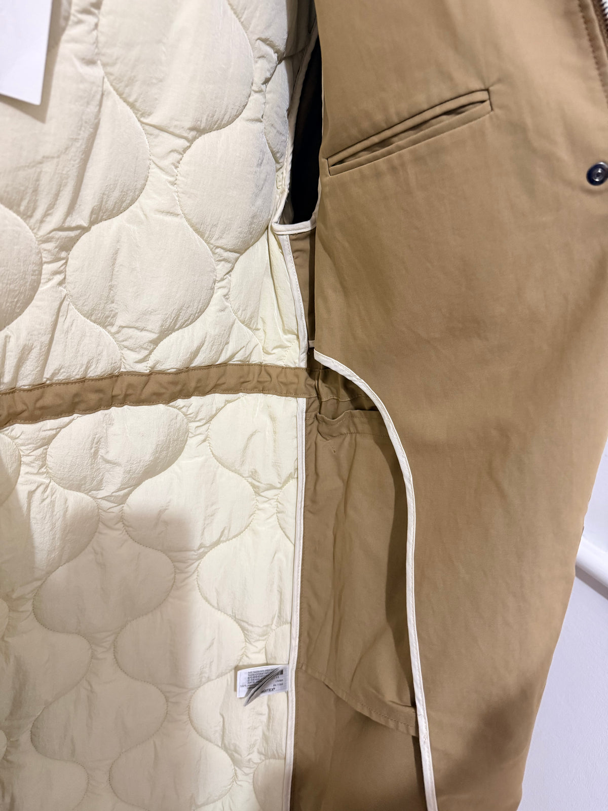     Close-up of Zara beige trench coat padded inner lining