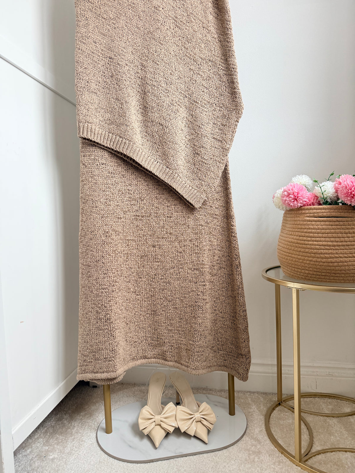     Close-up of Zara beige knit co-ord set asymmetric design