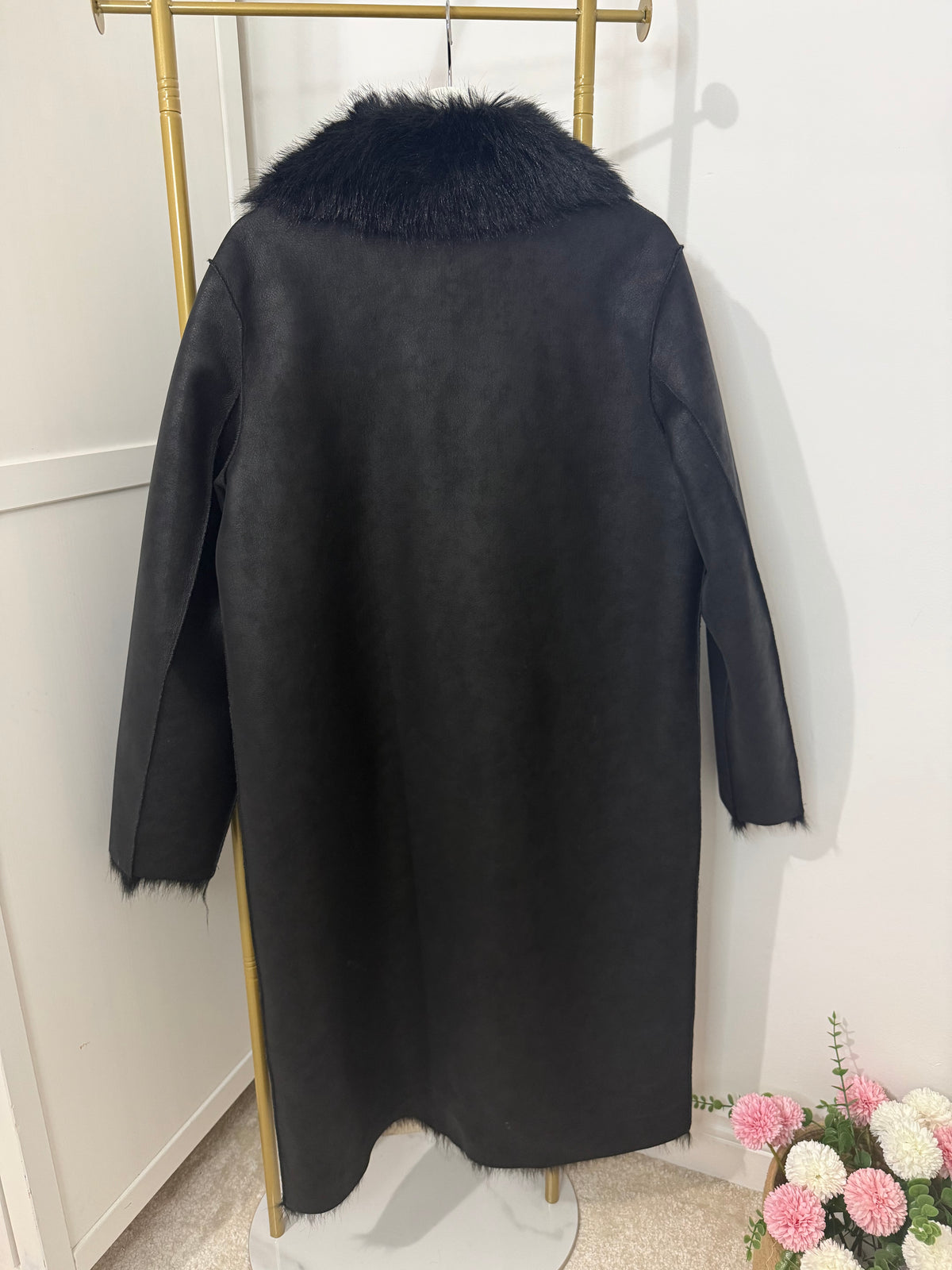     Back view of Zara black reversible long coat