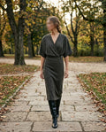     Woman wearing Zara khaki green knit belted midi dress
