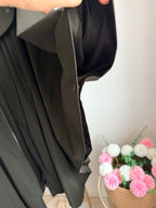     Close-up side detail of Zara khaki water repellent cape rain coat
