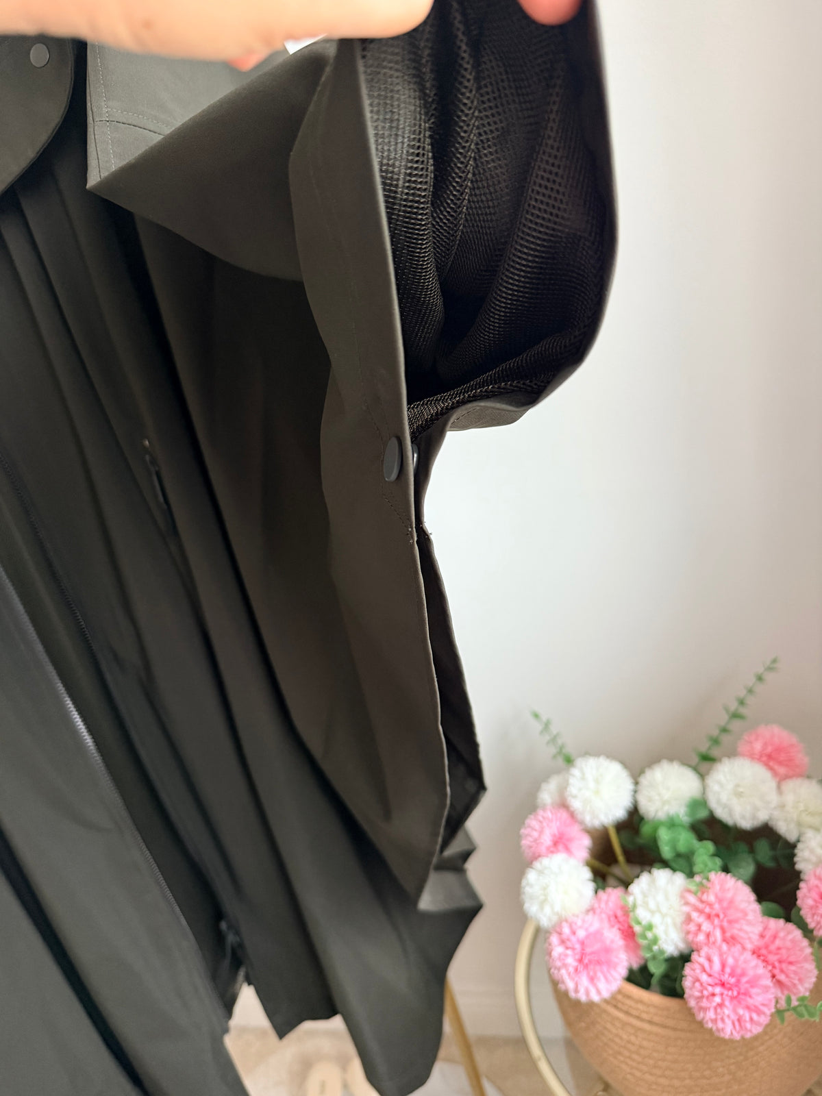     Close-up side detail of Zara khaki water repellent cape rain coat