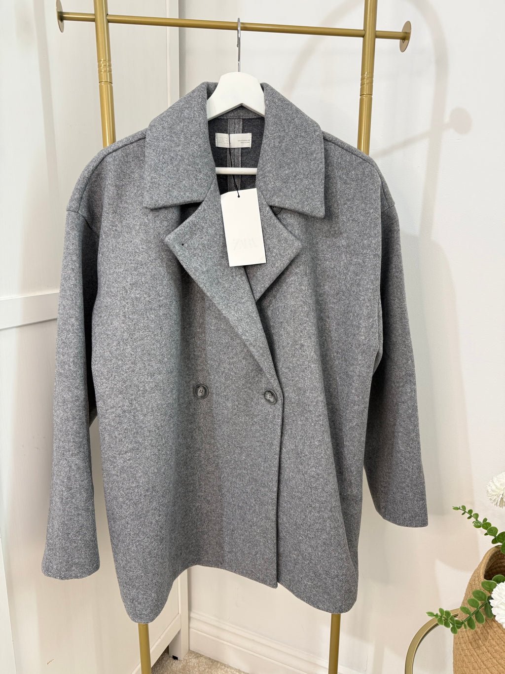    Close front view of Zara grey double breasted coat showing lapel collar