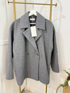     Close front view of Zara grey double breasted coat showing lapel collar