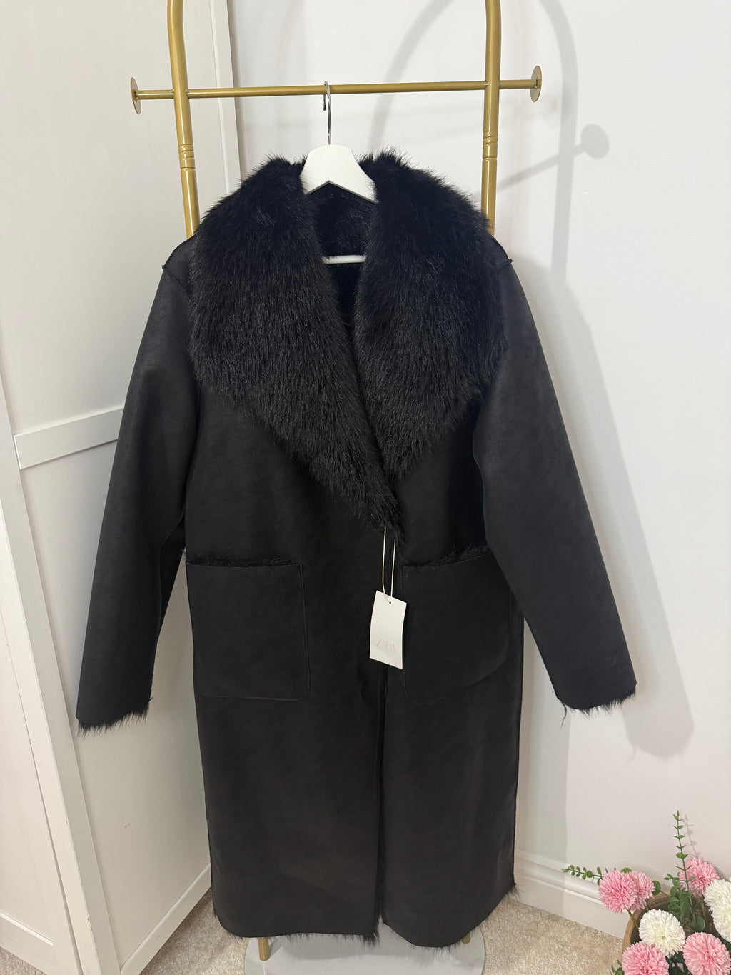     Front view of Zara black reversible long coat with faux fur collar