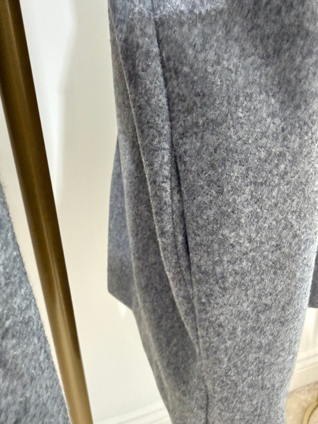     Close-up of grey fabric and sleeve detail on Zara oversized coat
