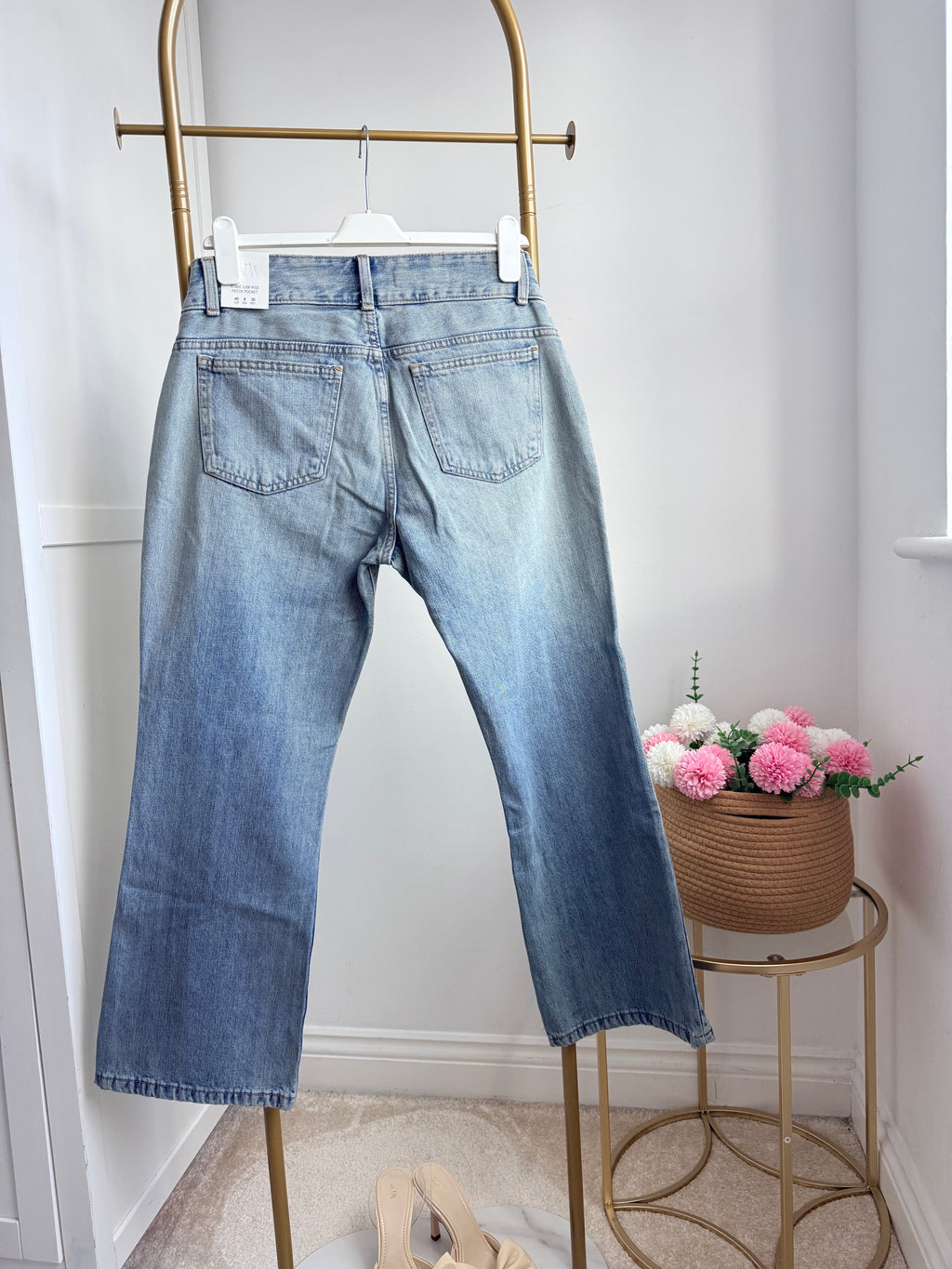     Full front view of Zara blue low rise flared jeans