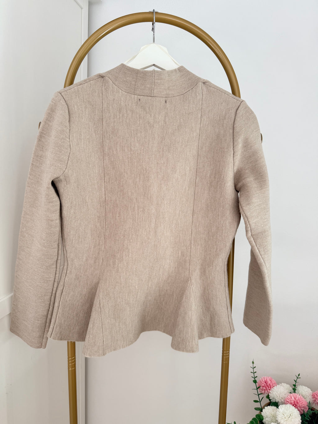     Close back view of Zara beige knit peplum cardigan