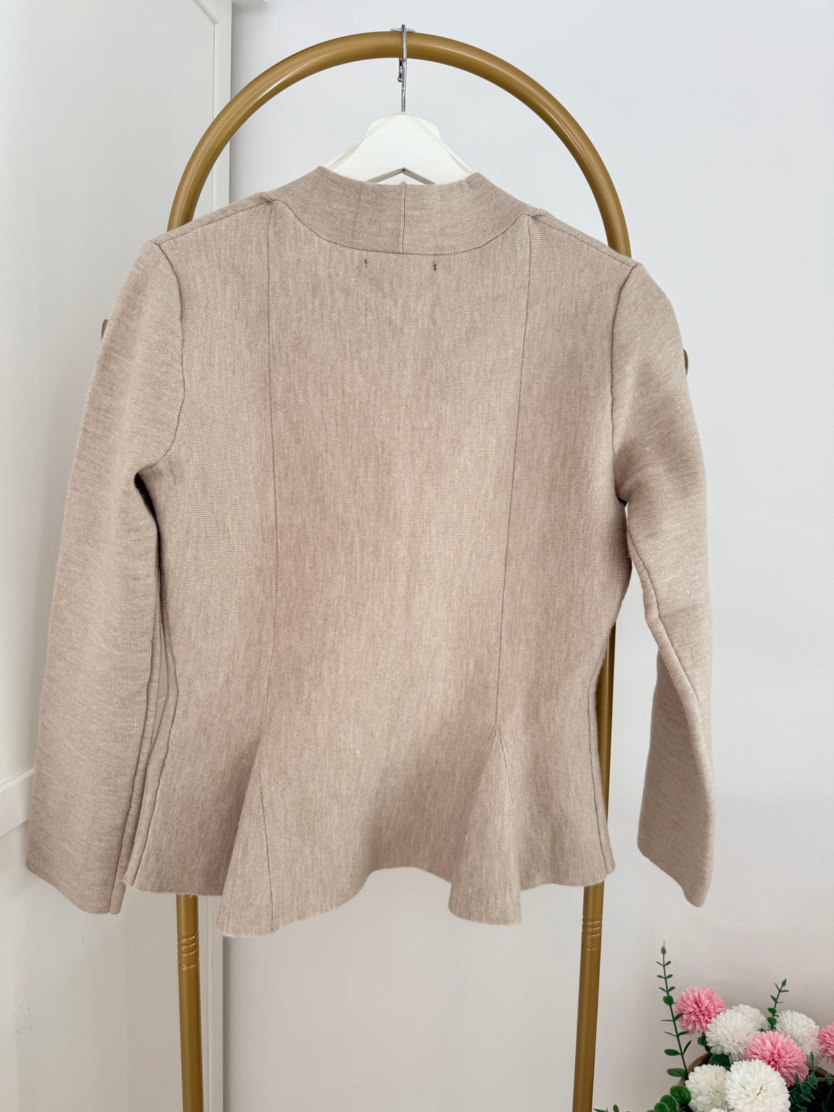    Close back view of Zara beige knit peplum cardigan