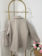     Back view of Zara beige oversized double breasted coat on hanger