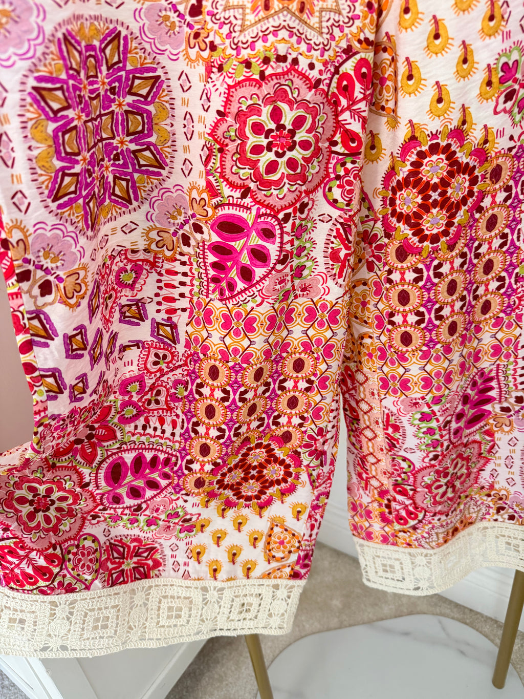     Zara pink multicoloured cropped trousers hem and print detail