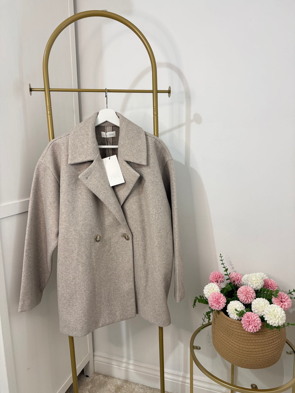     Front view of Zara beige oversized double breasted coat on hanger