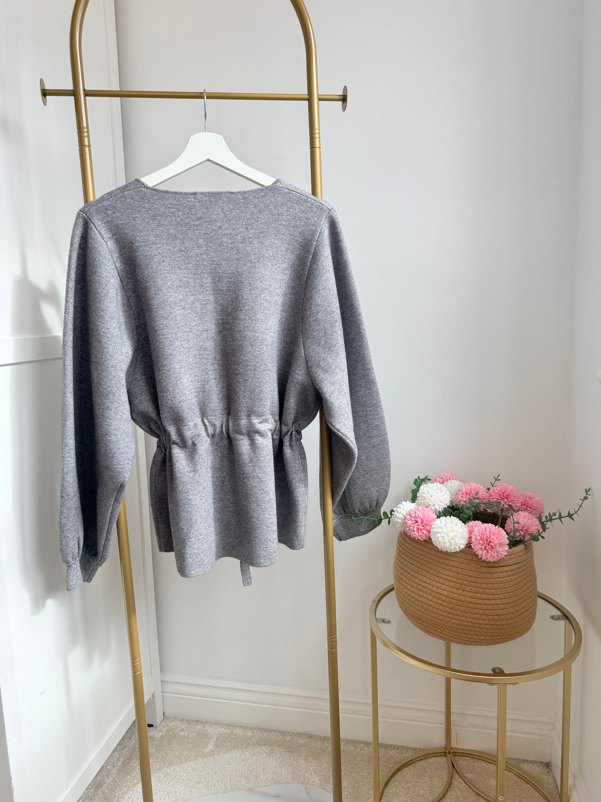     Back view of Zara grey belted knit jumper on hanger