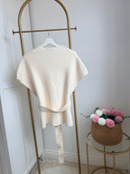     Back view of Zara cream knit belted waistcoat on hanger