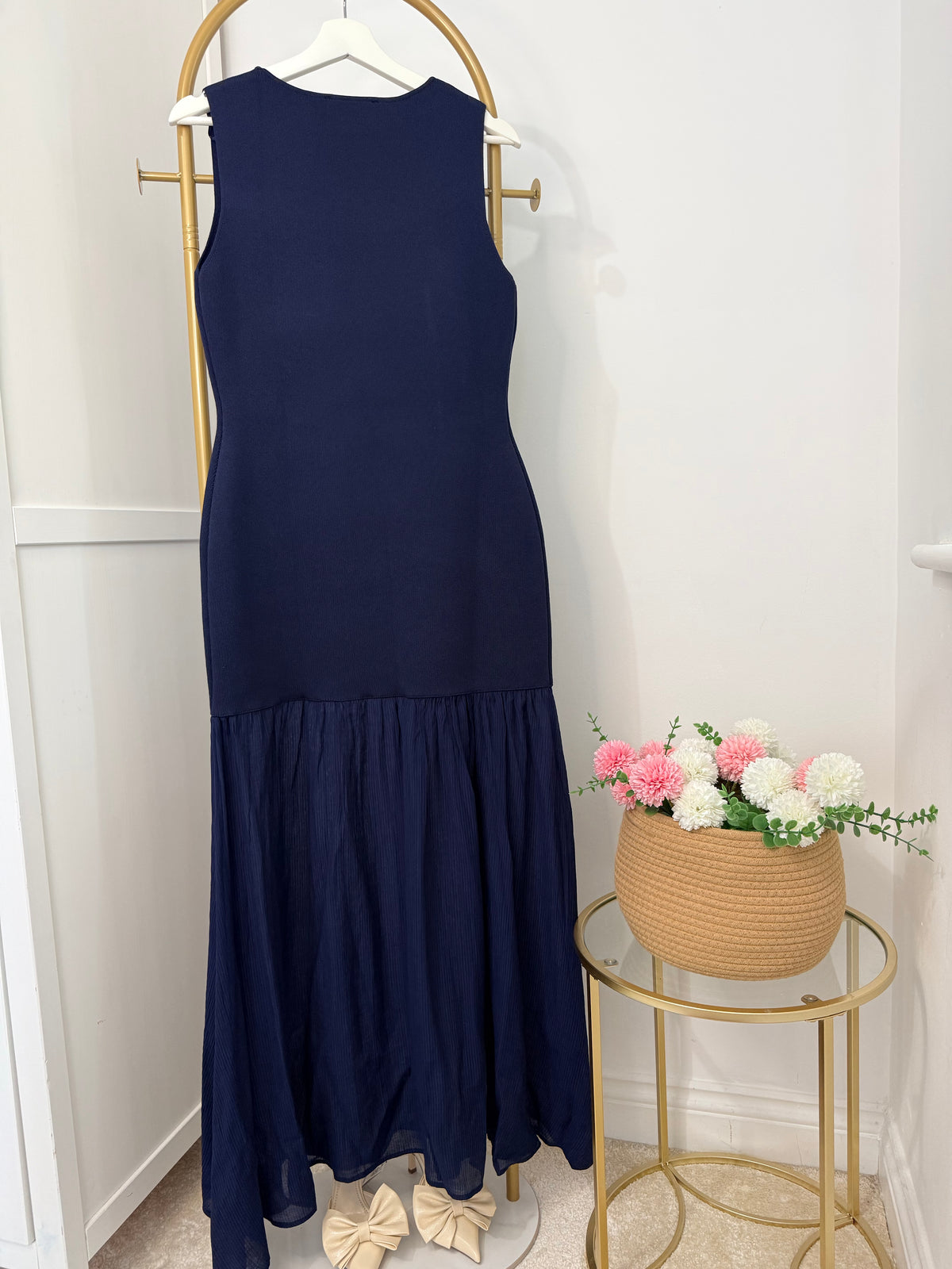     Side view of Zara blue midi dress showing fitted bodice and flowing skirt