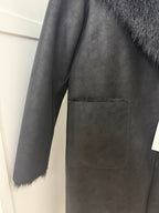     Close-up of Zara black reversible coat sleeve and pocket