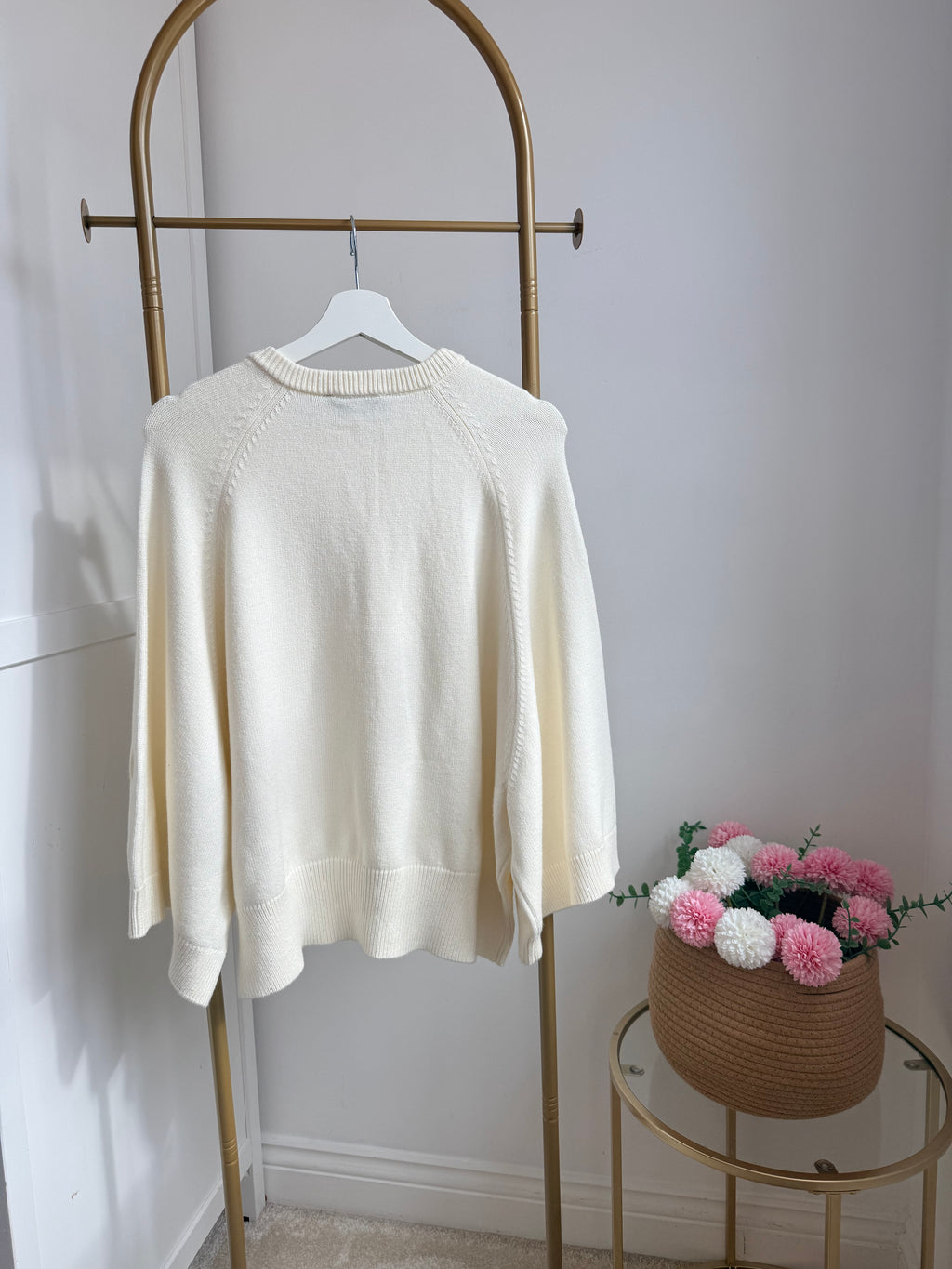     Back view of Zara cream wide sleeve knit jumper on hanger