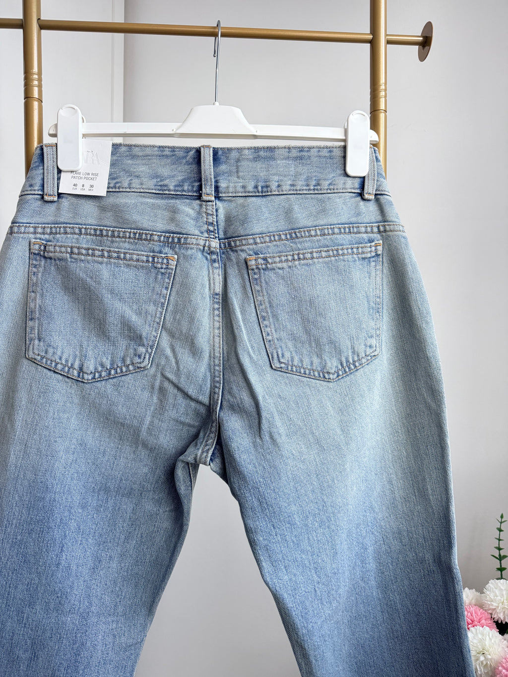     Back view of Zara blue low rise flared jeans