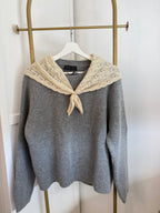     Front view of Zara grey knit sweater with contrast beige scarf