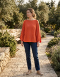     Zara orange knit batwing top styled on model