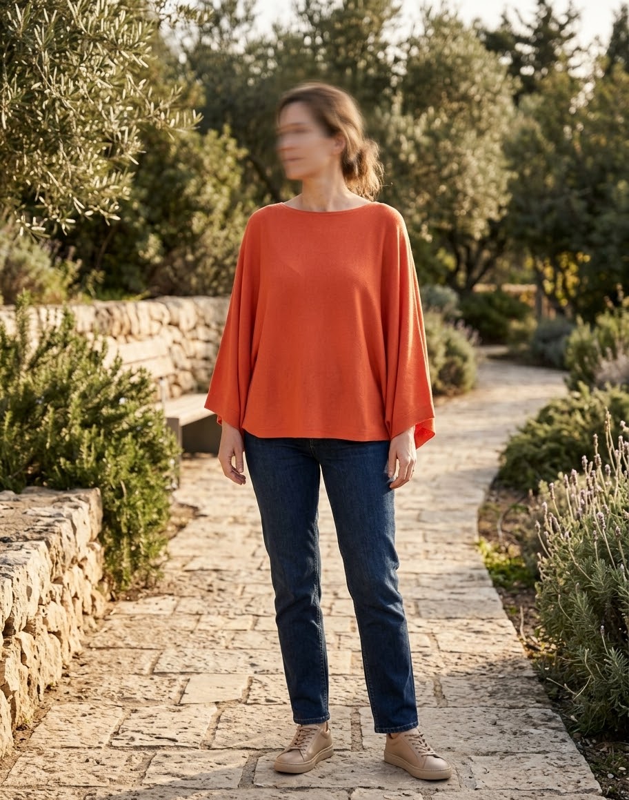     Zara orange knit batwing top styled on model