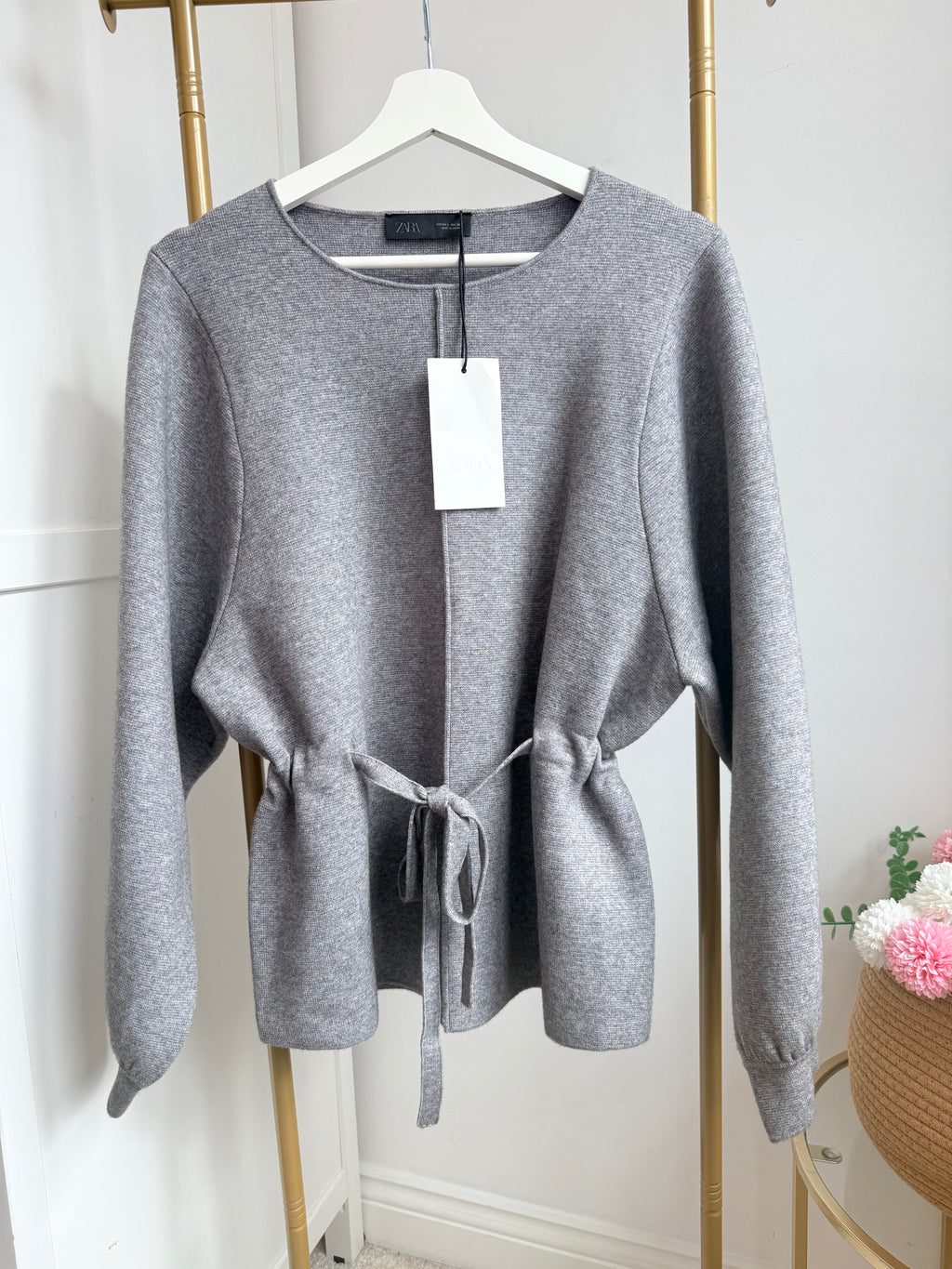     Close front view of Zara grey belted knit jumper showing tie waist belt