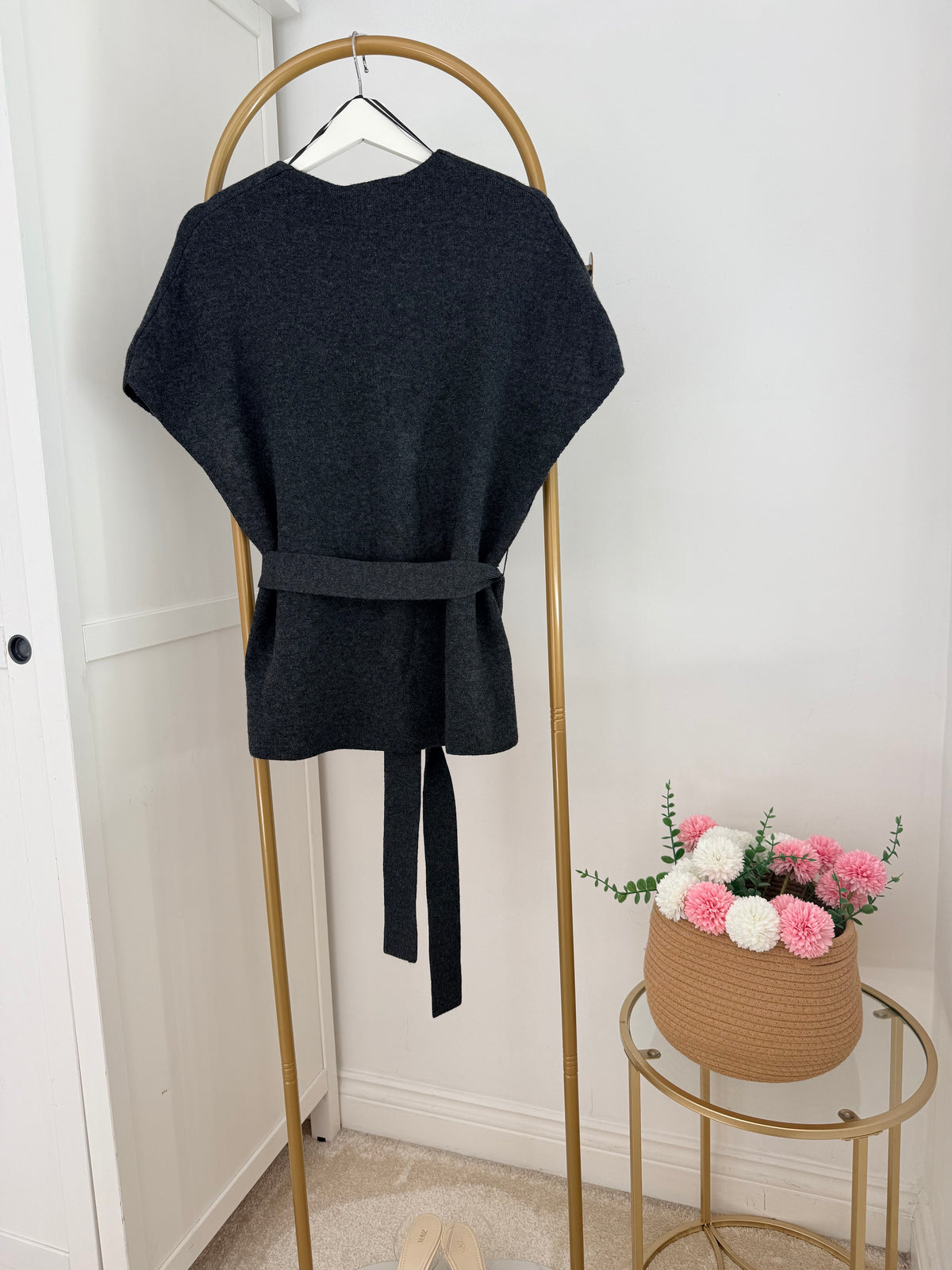     Back view of Zara grey knit belted waistcoat with tie belt