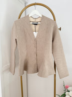     Close front view of Zara beige knit peplum cardigan