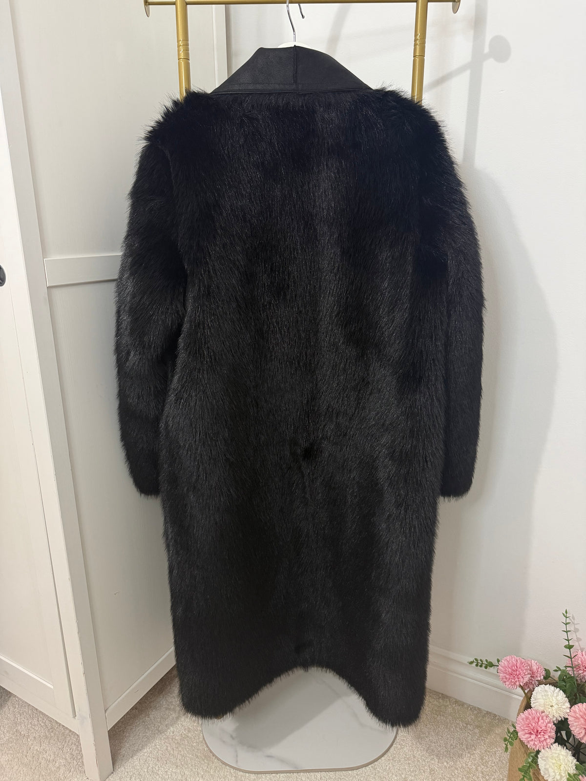     Back view of Zara black faux fur coat