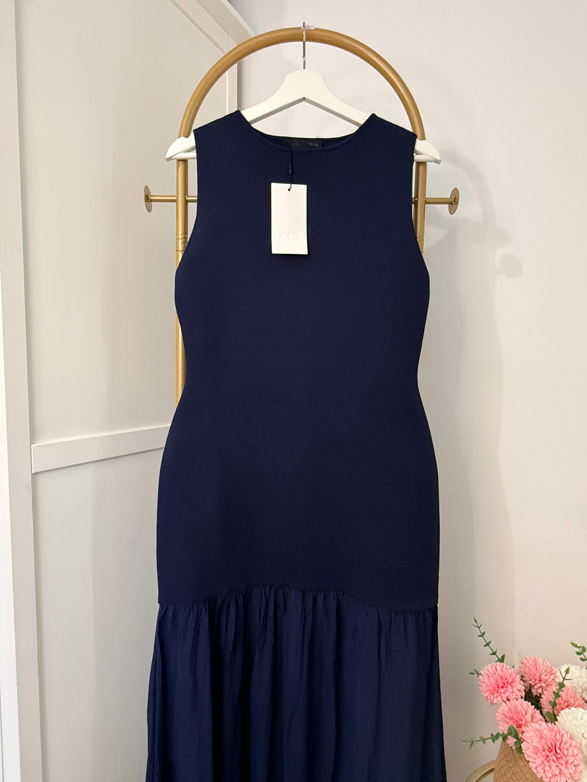     Close front view of Zara blue sleeveless midi dress on hanger