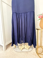     Close-up of flowing skirt and hem detail on Zara blue midi dress