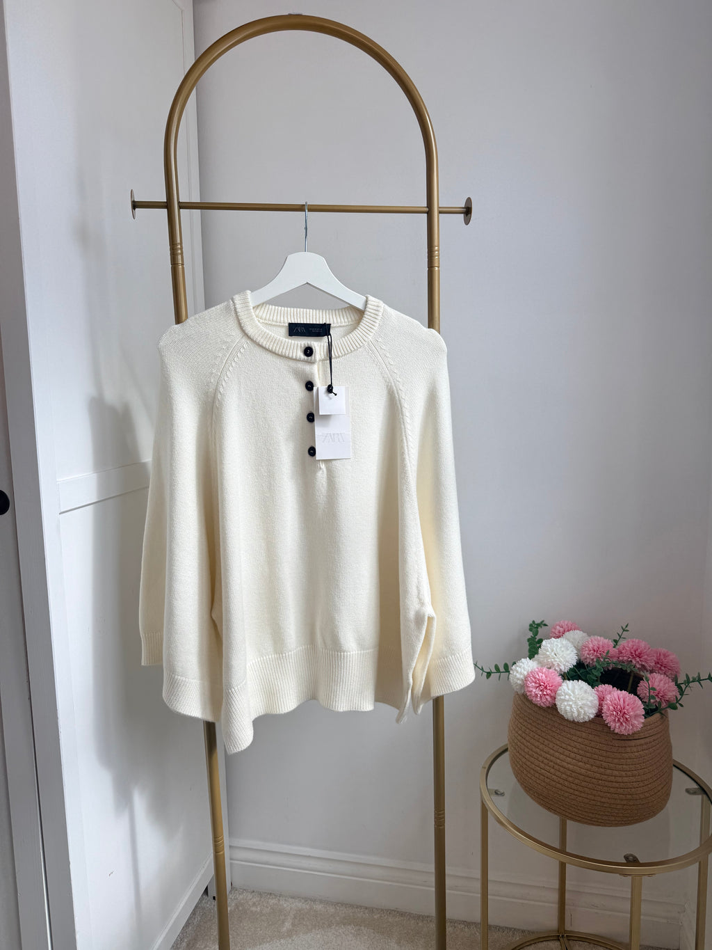     Front view of Zara cream wide sleeve knit jumper on hanger