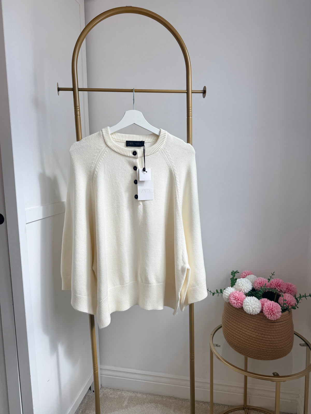     Front view of Zara cream wide sleeve knit jumper on hanger