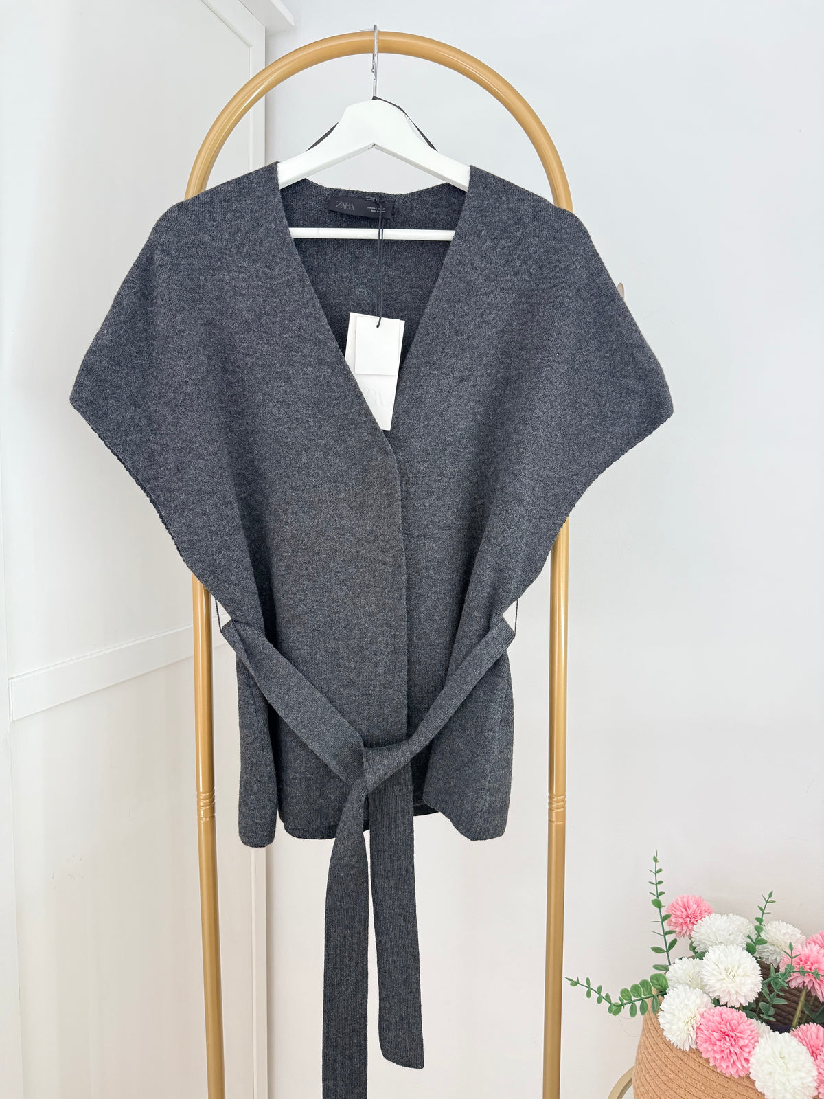     Close front view of Zara grey knit belted waistcoat